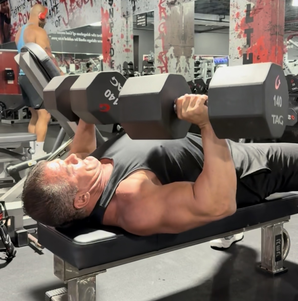 Ryan Benroth pressing 140lb dumbbells at 48 — Built By Benroth